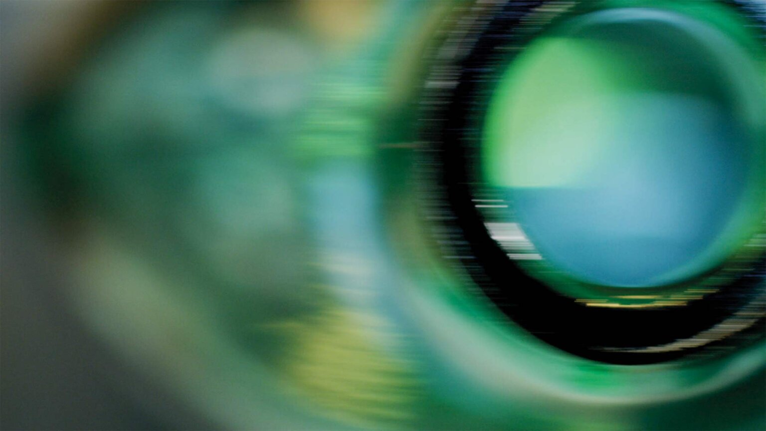 The textures and reflections of green glass